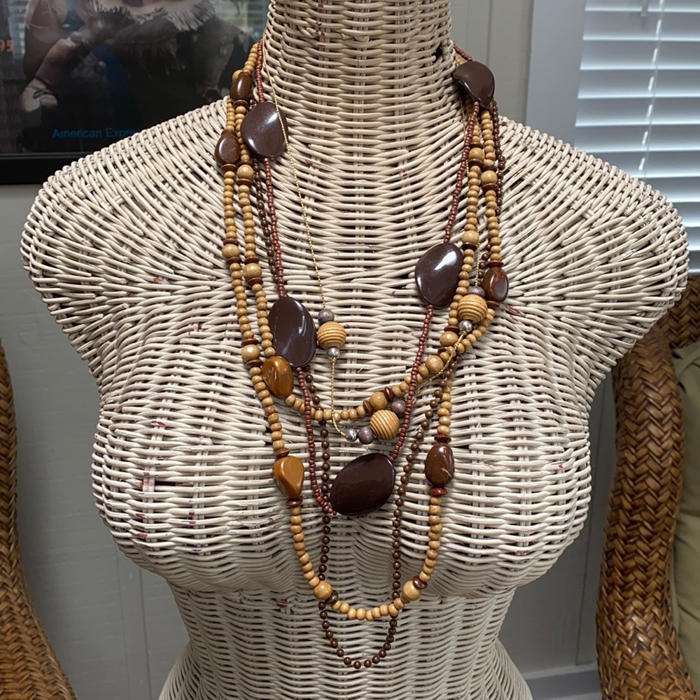 Four brown wooden necklaces for layering